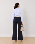 Diane navy blue mid waist formal trousers, back view of the wide leg fit