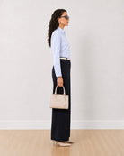 Diane navy blue formal trousers, side profile view of the full length wide leg
