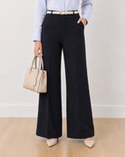 Diane navy blue formal trousers, waist down front view of the mid waist wide leg