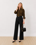 Dimona black and orange checked oversized shirt, front view with rolled sleeves
