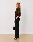Dimona black and orange checked shirt, side profile view of the long curved hem