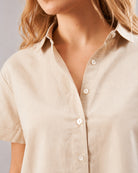 Doll beige half sleeves shirt detail, pointed collar and hidden dignity buttons