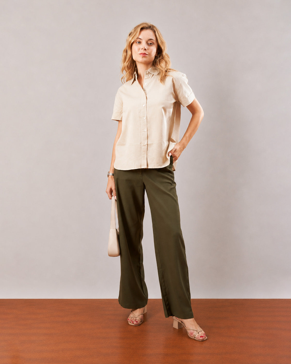 Doll beige cotton linen size inclusive shirt, full length front view with hand on the hip
