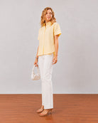 Doll lemon yellow cotton linen short sleeves shirt, boxy fit angled front view