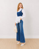 Donna white and indigo denim shirt corset set, angled front view with curved hem