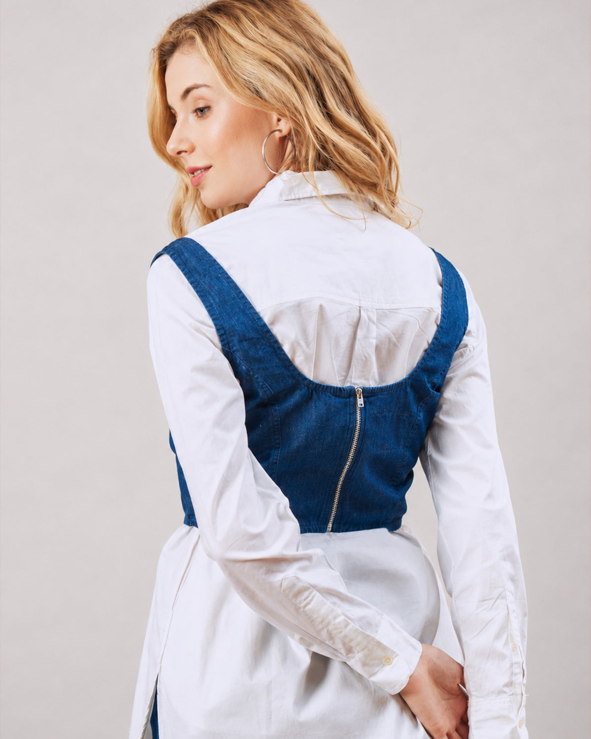 Donna indigo denim corset with white shirt, close up back detail of the zip opening