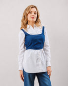 Donna white oversized shirt with indigo denim corset, front view of the button placket