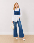 Donna white 100% cotton shirt with indigo denim corset, full length walking front view