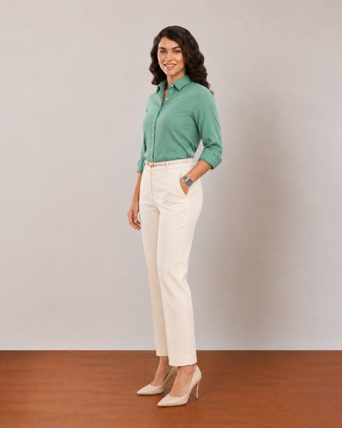 Dora emerald green formal shirt, angled front view with sleeves rolled to the elbow