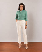 Gazillion Dora emerald green cotton linen formal shirt for women, full length front view worn tucked in