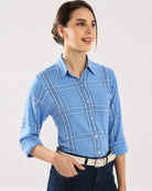 Close-up of Earnia blue checks shirt front placket with hidden dignity buttons
