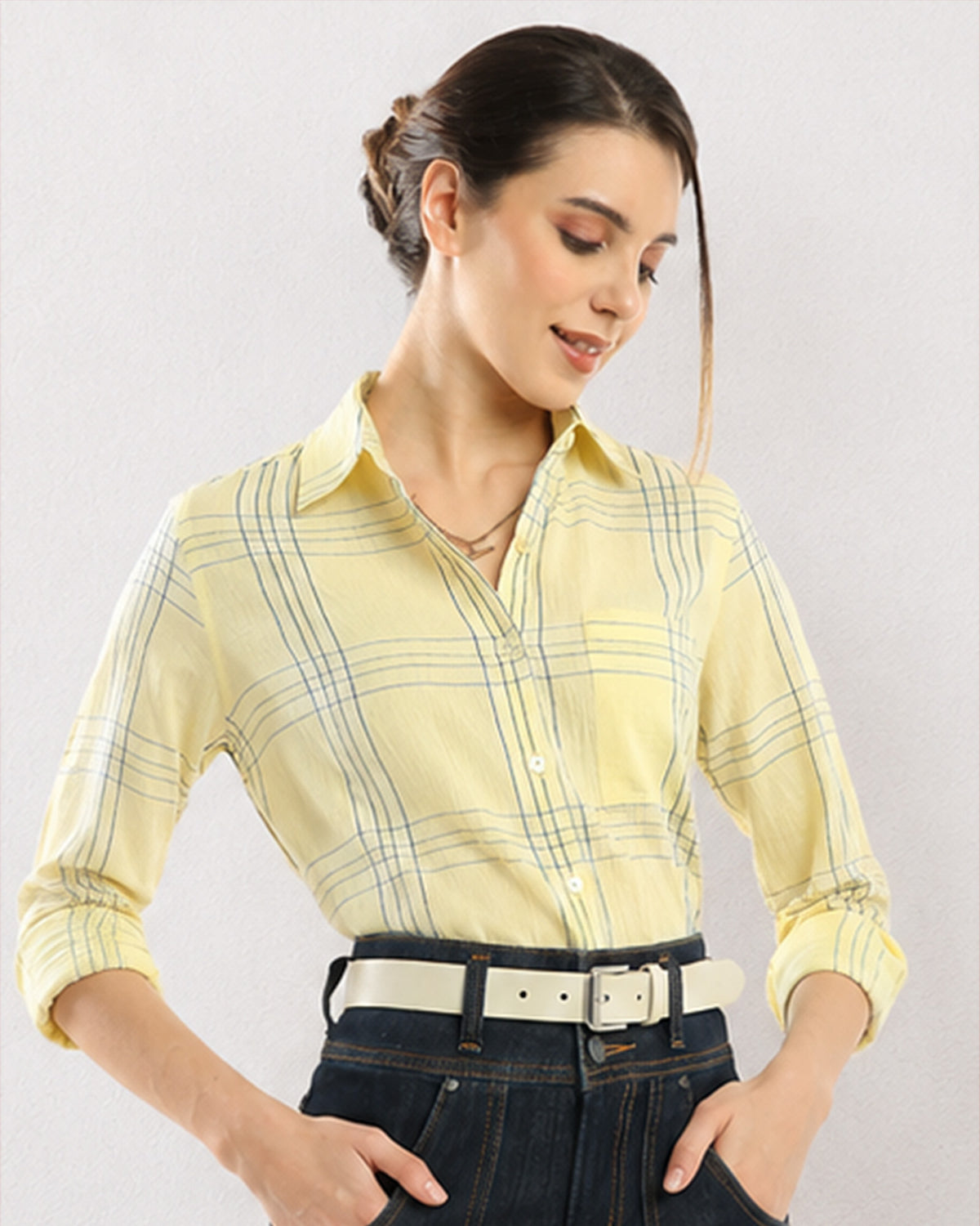 Close-up of Earnia yellow checks shirt shoulder seam and front placket buttons