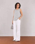 Easel white linen blend formal pants with a straight fit and full length, angled front view