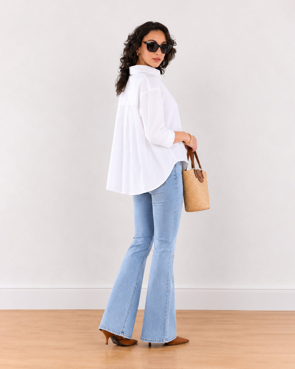 Elizabeth white cotton shirt with all-over back pleats, angled back view