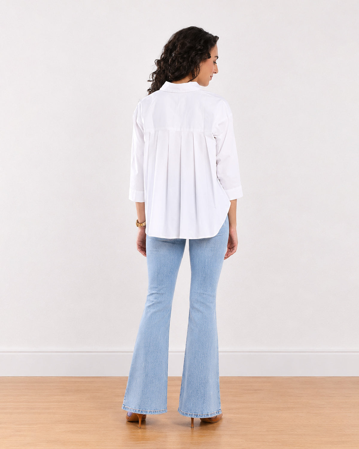 Elizabeth white cotton shirt, back view showing the all-over back pleats