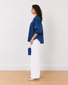 Close-up of Ellie dark blue cotton shirt 3/4 puff sleeve and side gathers