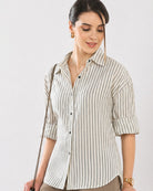 Close-up of Empathy black and ivory shirt button placket and dignity buttons