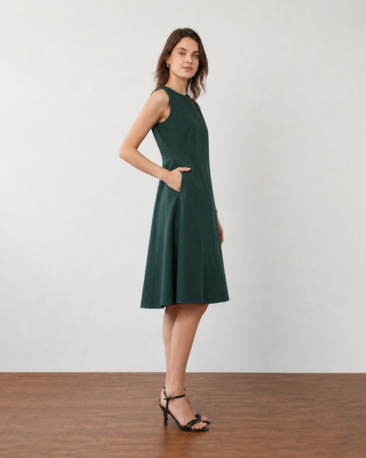 Freya pine green fit-and-flare midi dress, side profile showing the flared skirt