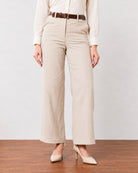 Close-up of Gabriela beige linen pants waistband, belt loops and fly front with pocket