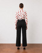 Gabriela black business casual linen pants with cotton voile lining, back view with welt rear pockets