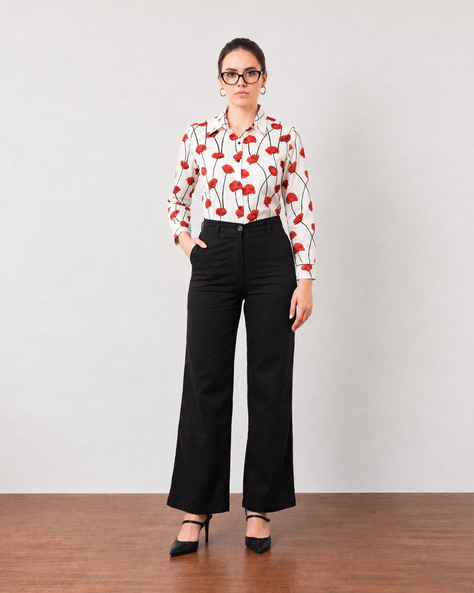 Gabriela black breathable linen pants with cotton voile lining, front view with hand in pocket