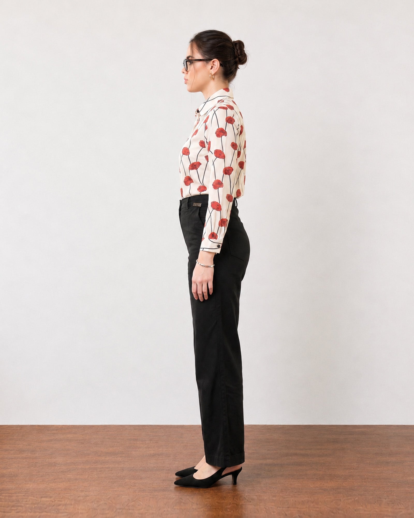 Gabriela black linen pants with full cambric lining, side profile showing a straight leg