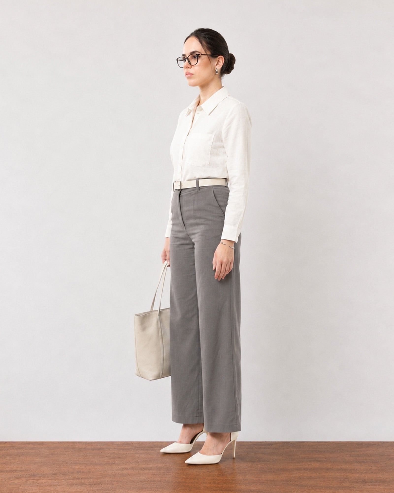 Gabriela charcoal grey smart linen trousers with full cambric lining, angled full-length view