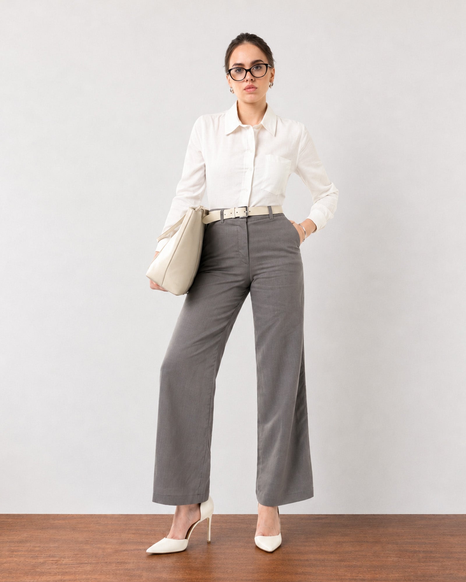 Gabriela charcoal grey executive trousers with full cambric lining, front view, hands in pockets