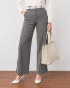 Close-up of Gabriela charcoal grey linen pants waistband, belt loops and side pocket
