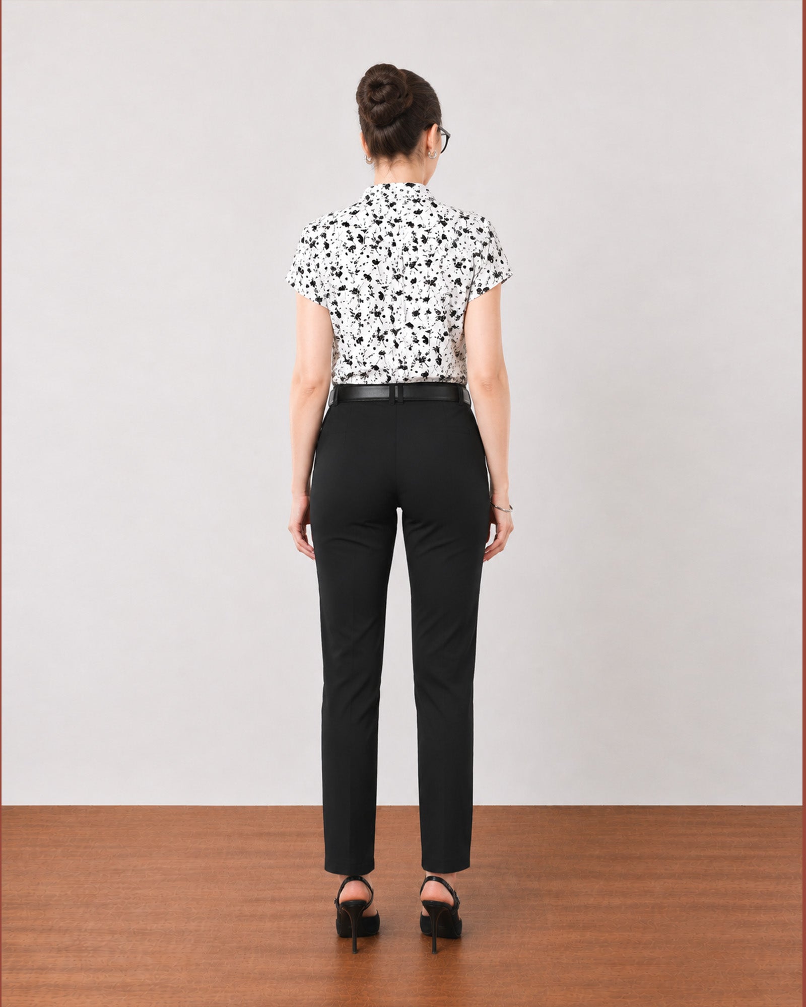 Galia black and white floral printed top, back view showing a relaxed Barcelona fit