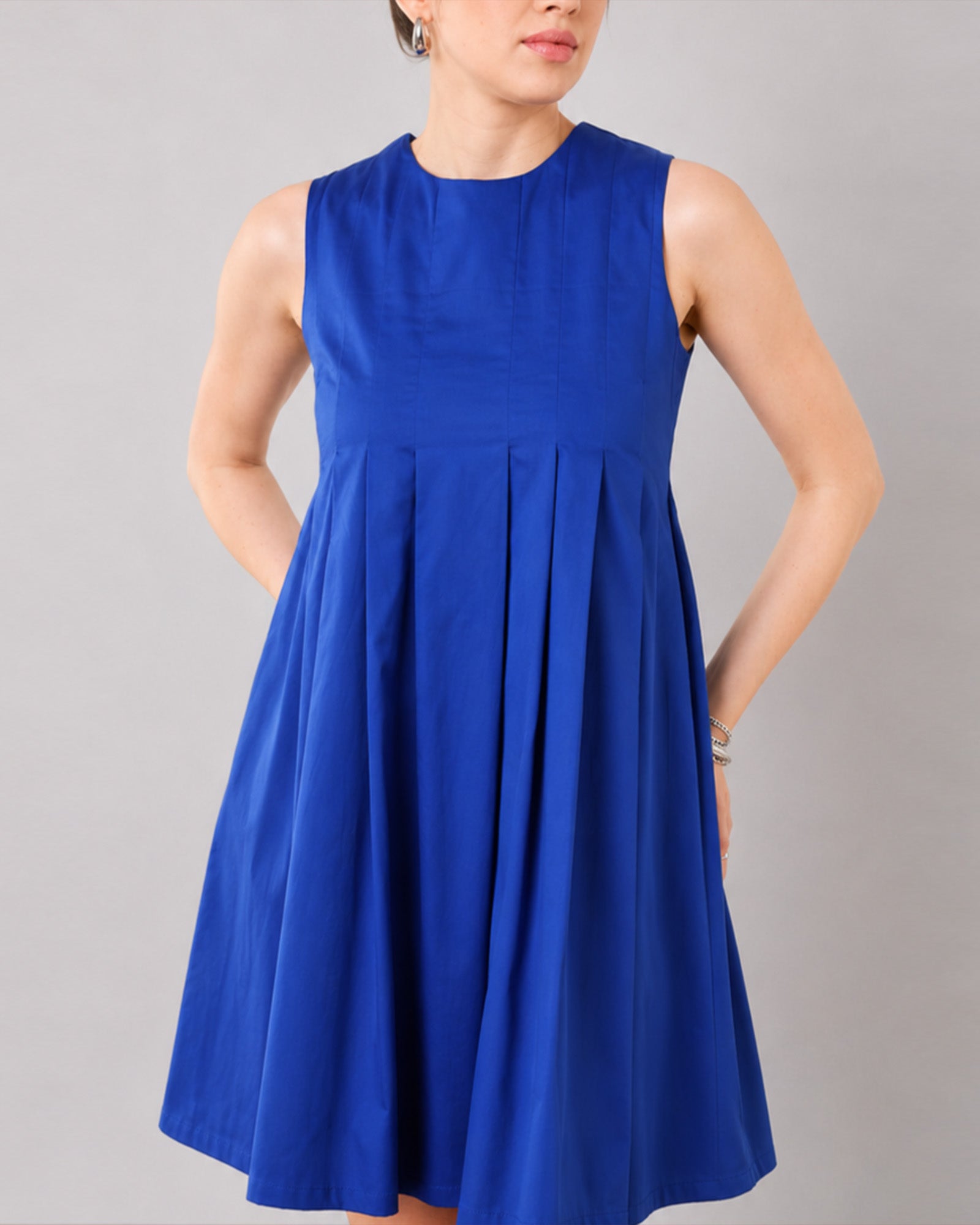 Close-up of Garcia royal blue dress round neckline, yoke and soft released front pleats