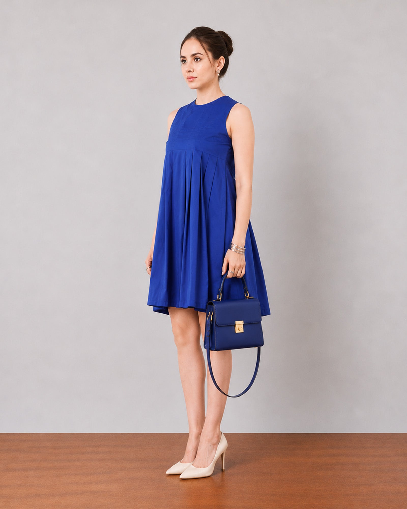 Garcia royal blue pleated dress with full cambric lining, side profile above the knee