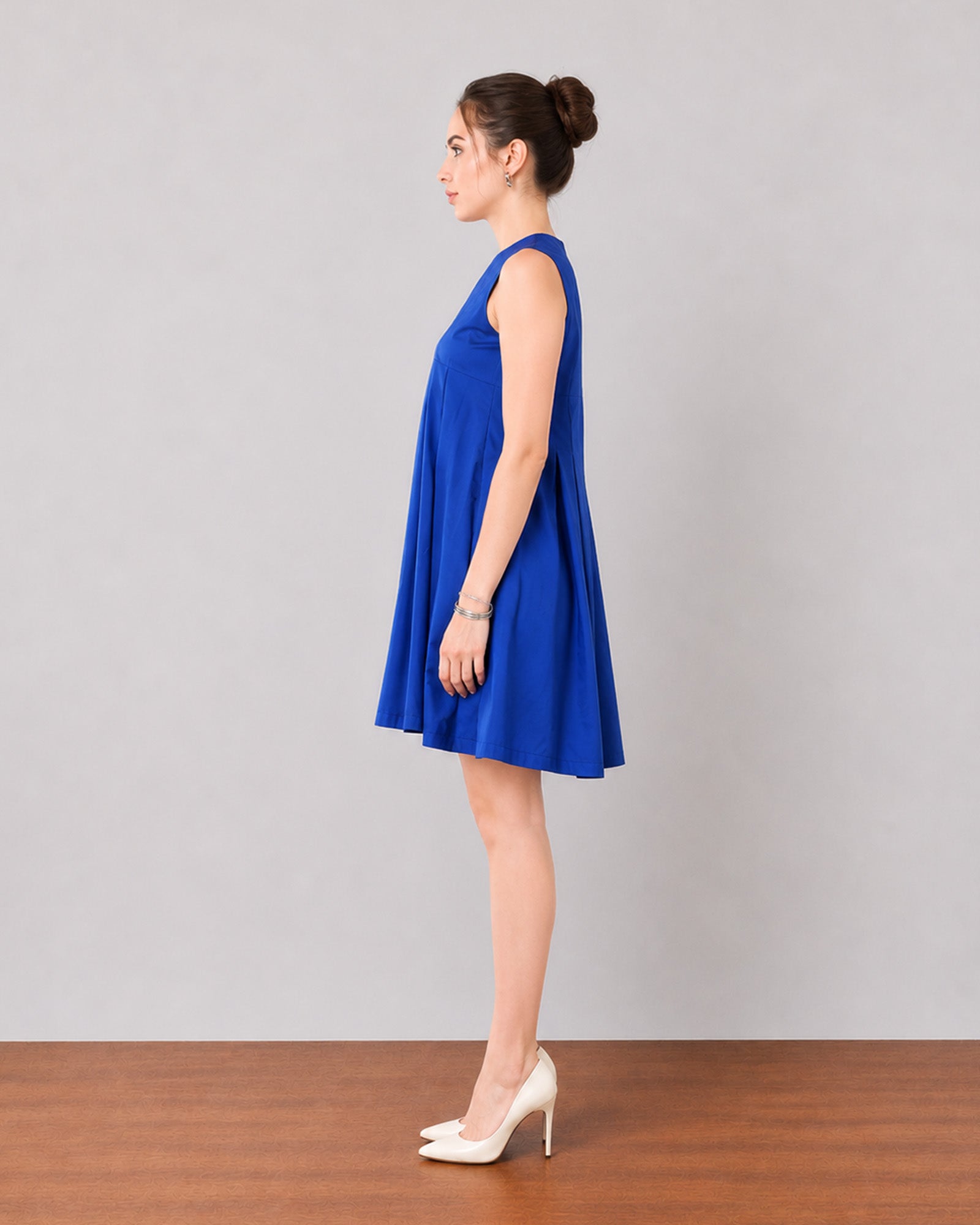 Garcia royal blue cotton tent dress with cotton voile lining, walking view with flare