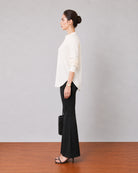 Gemini beige breathable lyocell linen tunic top, side profile showing the curved side-split hem