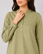 Close-up of Gemini moss green linen tunic split V-neckline, band collar and button placket