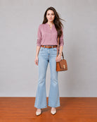 Gemini rose pink linen tunic top with a band collar and button placket, angled front view