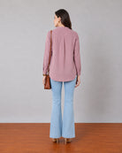 Gemini rose pink linen tunic top, back view showing shoulder pleats and a curved split hem