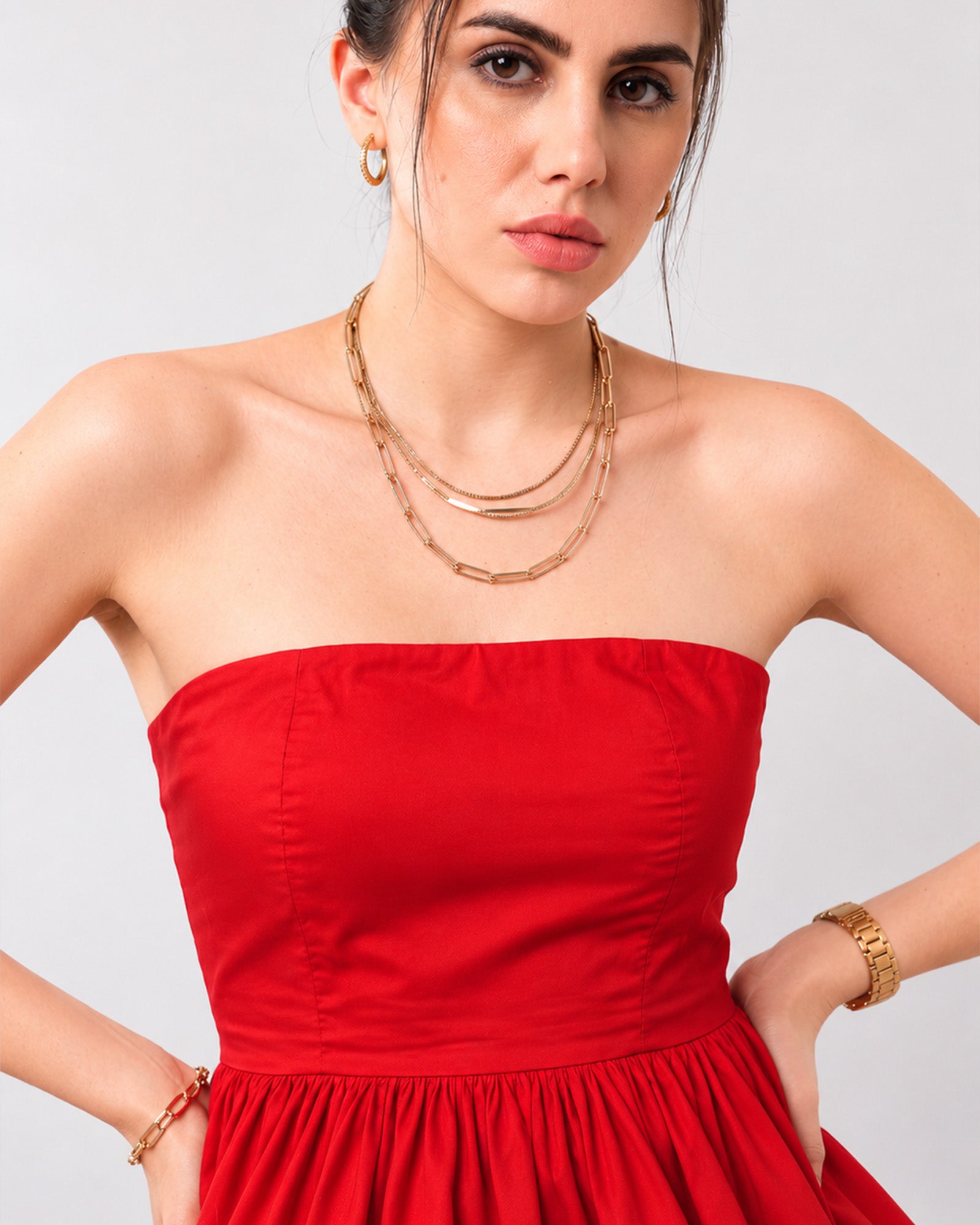 Close-up of Gemma scarlet red strapless bodice with Silicone grip tape, princess seams and a gathered peplum hem