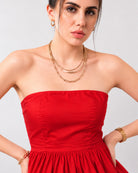 Close-up of Gemma scarlet red strapless bodice with Silicone grip tape, princess seams and a gathered peplum hem
