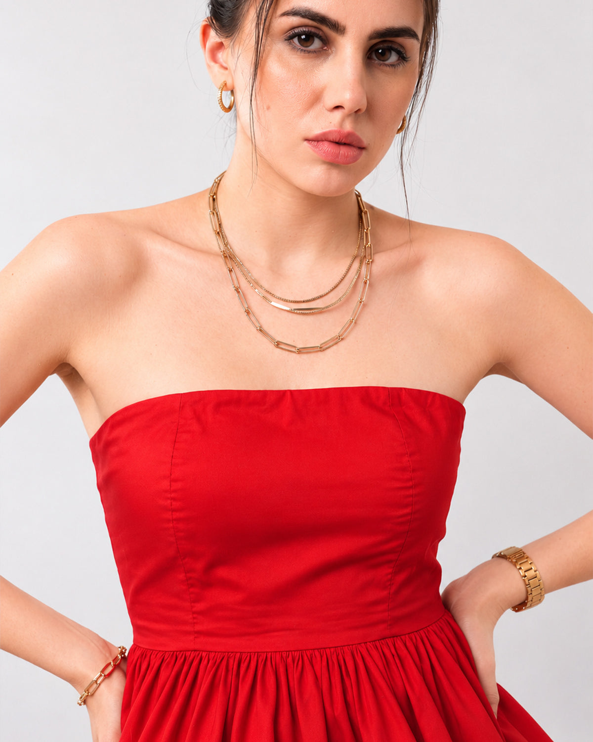 Close-up of Gemma scarlet red strapless bodice with silicone grip tape, princess seams and gathered peplum hem