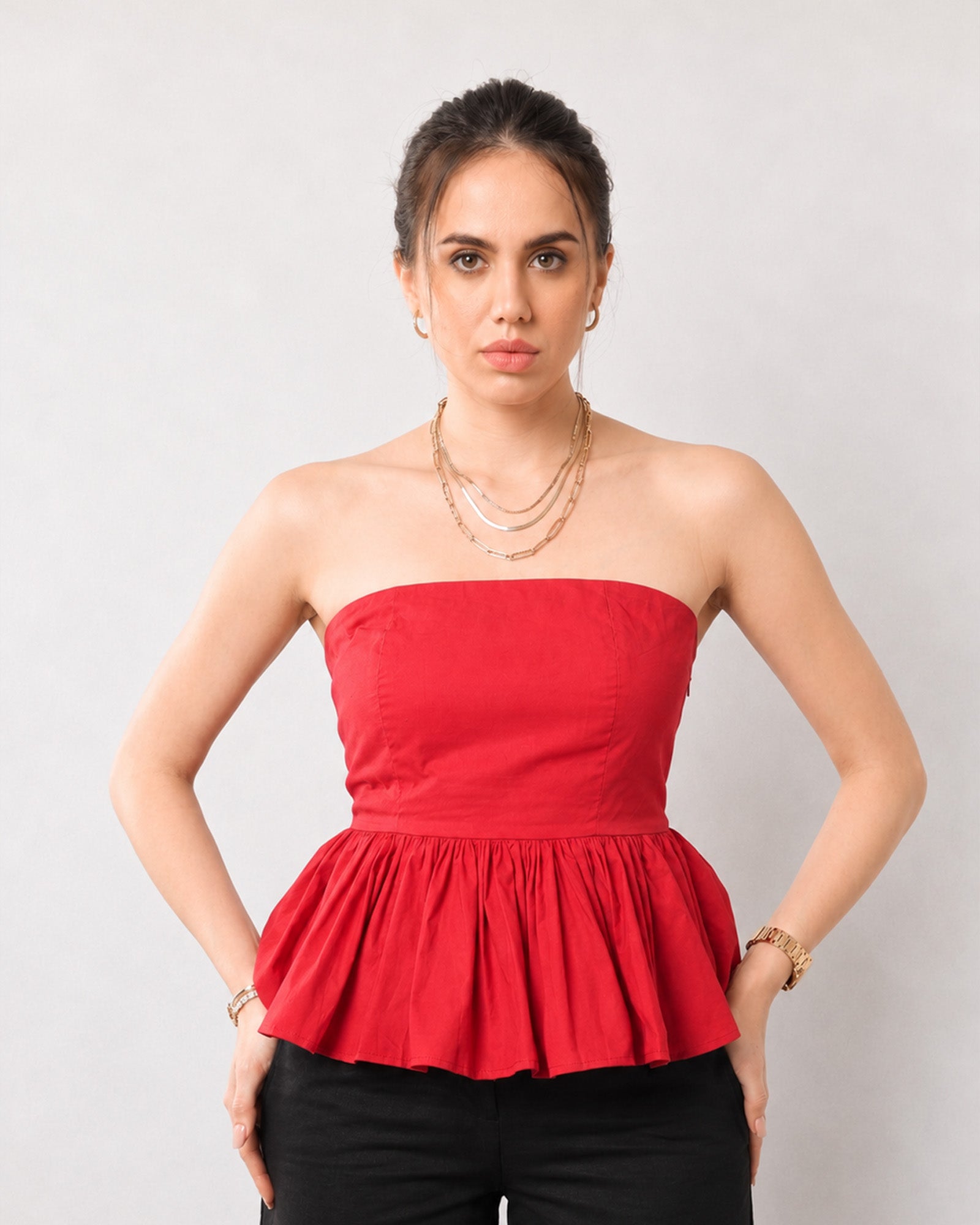 Gemma scarlet red strapless peplum top with dense gathers at the hem, front detail