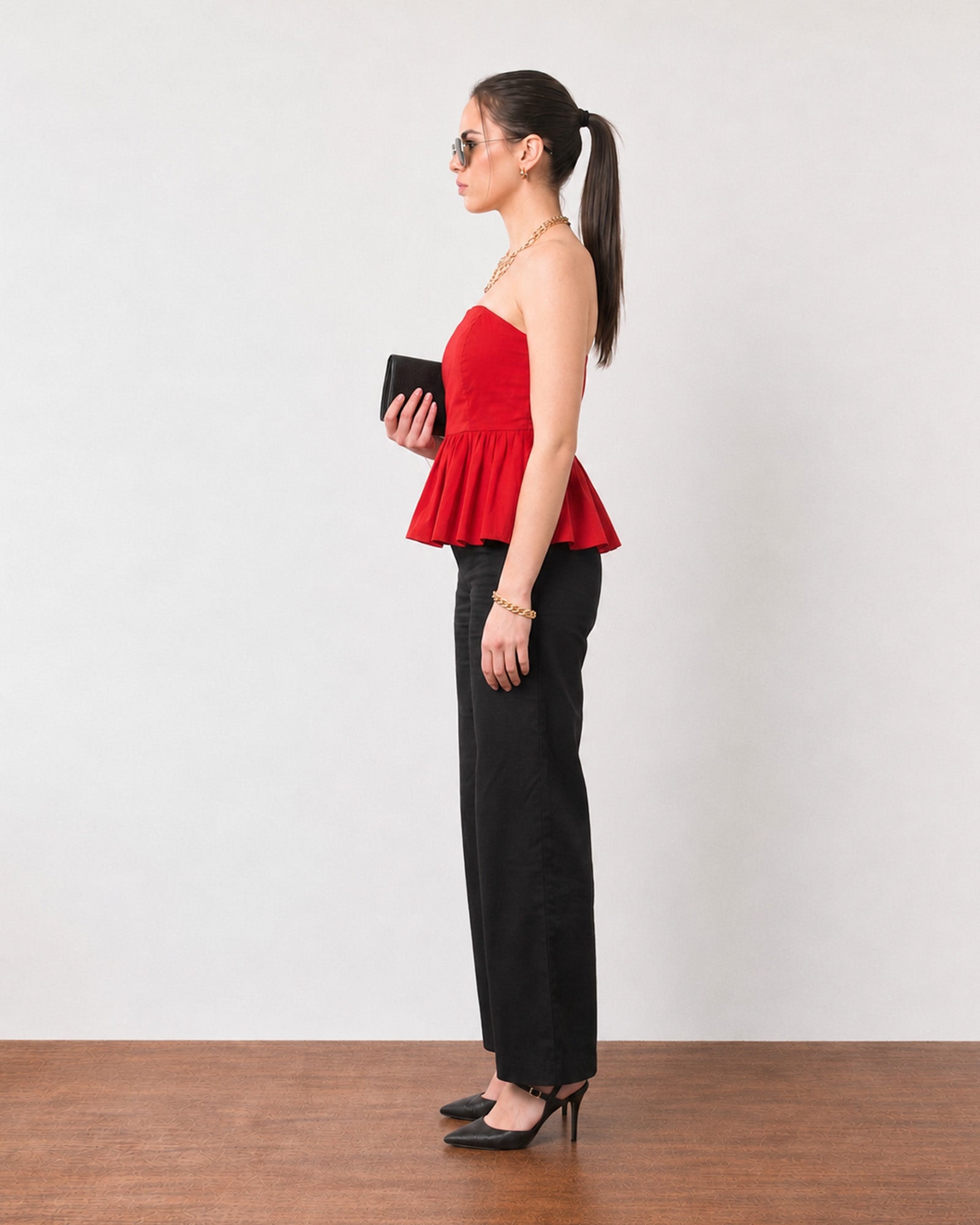 Gemma scarlet red cotton peplum top, side profile showing the flared gathered hem