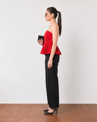 Gemma scarlet red cotton peplum top, side profile showing the flared gathered hem