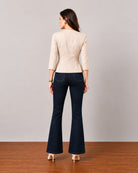 Georgia beige cotton blazer with cotton voile lining, back view showing the tailored waist seam and peplum flare