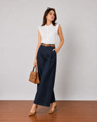 Gigi indigo blue denim pants with a wide barrel leg, walking view