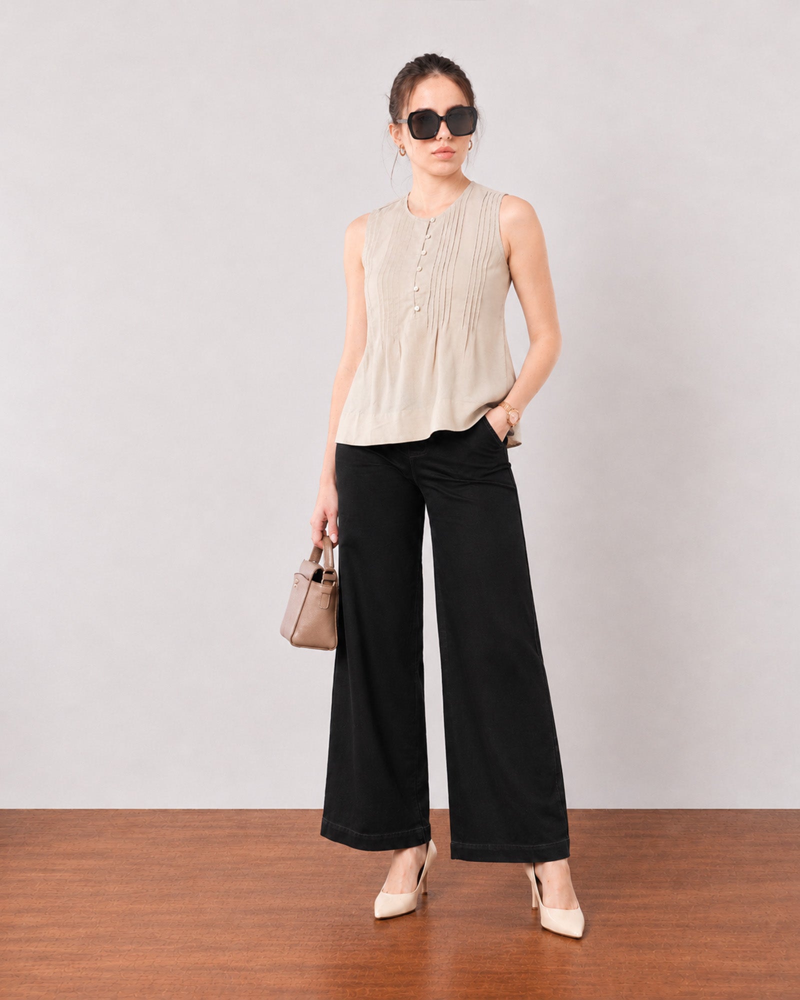 Gill beige sleeveless linen top with delicate pin tucks, angled front view