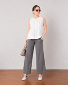 Gill white sleeveless linen top with delicate pin tucks, angled front view