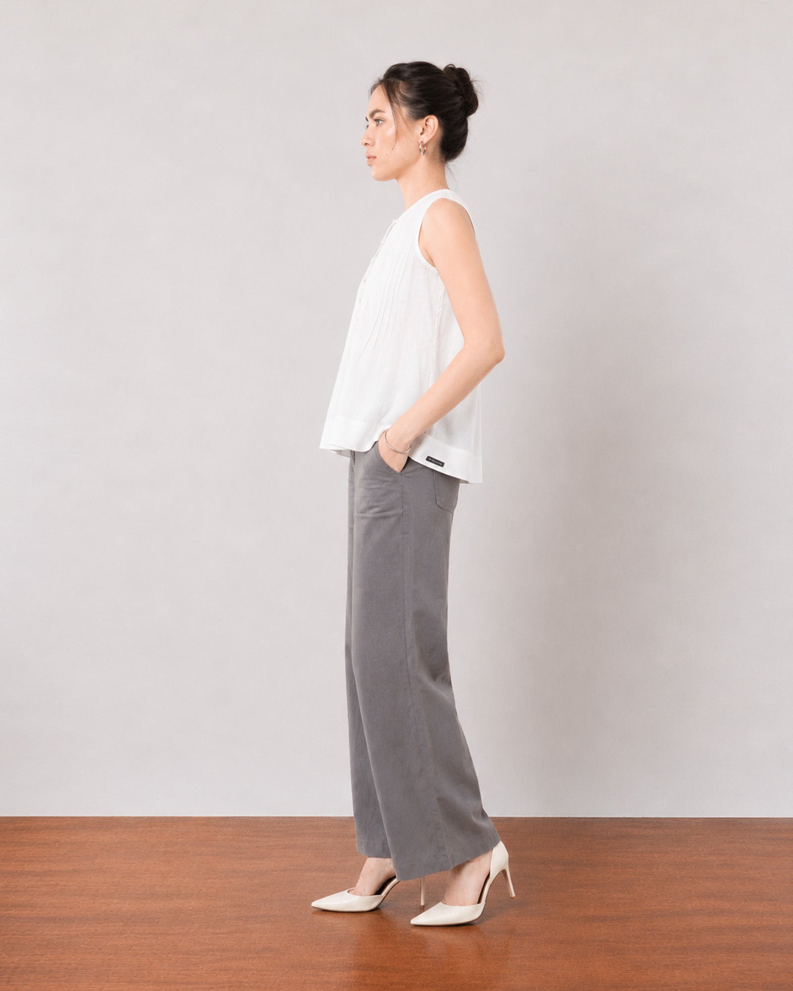 Gill white breathable lyocell linen top, side profile showing the broad flared hem