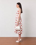 Gina red and white floral midi dress with cotton voile lining, side profile view