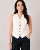 Ginger beige sleeveless linen vest with a V-neckline and pointed hem, angled view